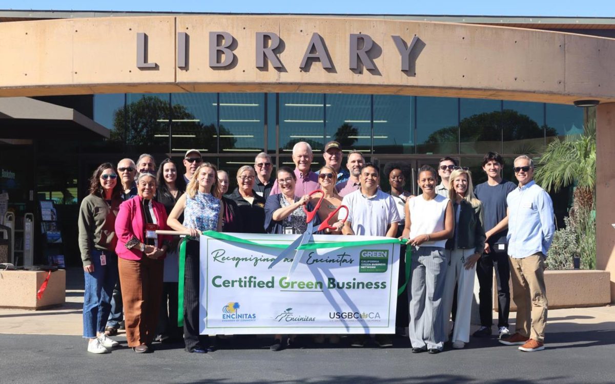 Encinitas Library staff and members of the Chamber of Commerce, city leadership and management, and U.S. Green Building Council California celebrate the library’s green business certification with a ribbon-cutting Nov. 6. (Courtesy photo)