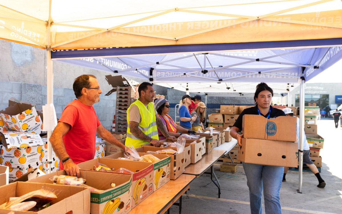 Interfaith Community Services members run a food distribution event Thursday, Oct. 30, in Escondido. (Interfaith Community Services social media photo)