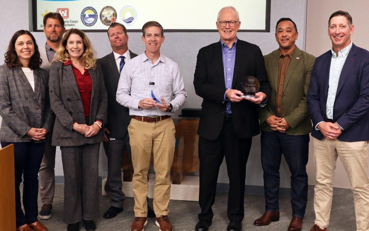 Encinitas and regional officials celebrate a shared 2025 Best Restored Beach Award with Solana Beach at Encinitas City Hall on Feb. 19 for efforts to replenish sand along portions of the cities’ beaches. (Encinitas city photo)