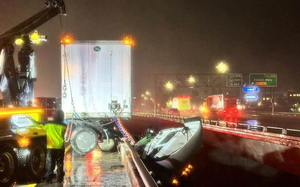 Oceanside Fire Department responders work to stabilize a big rig cab that went over the San Luis Ray River bridge on northbound Interstate 5 early Wednesday, Feb. 11. (OFD photo)