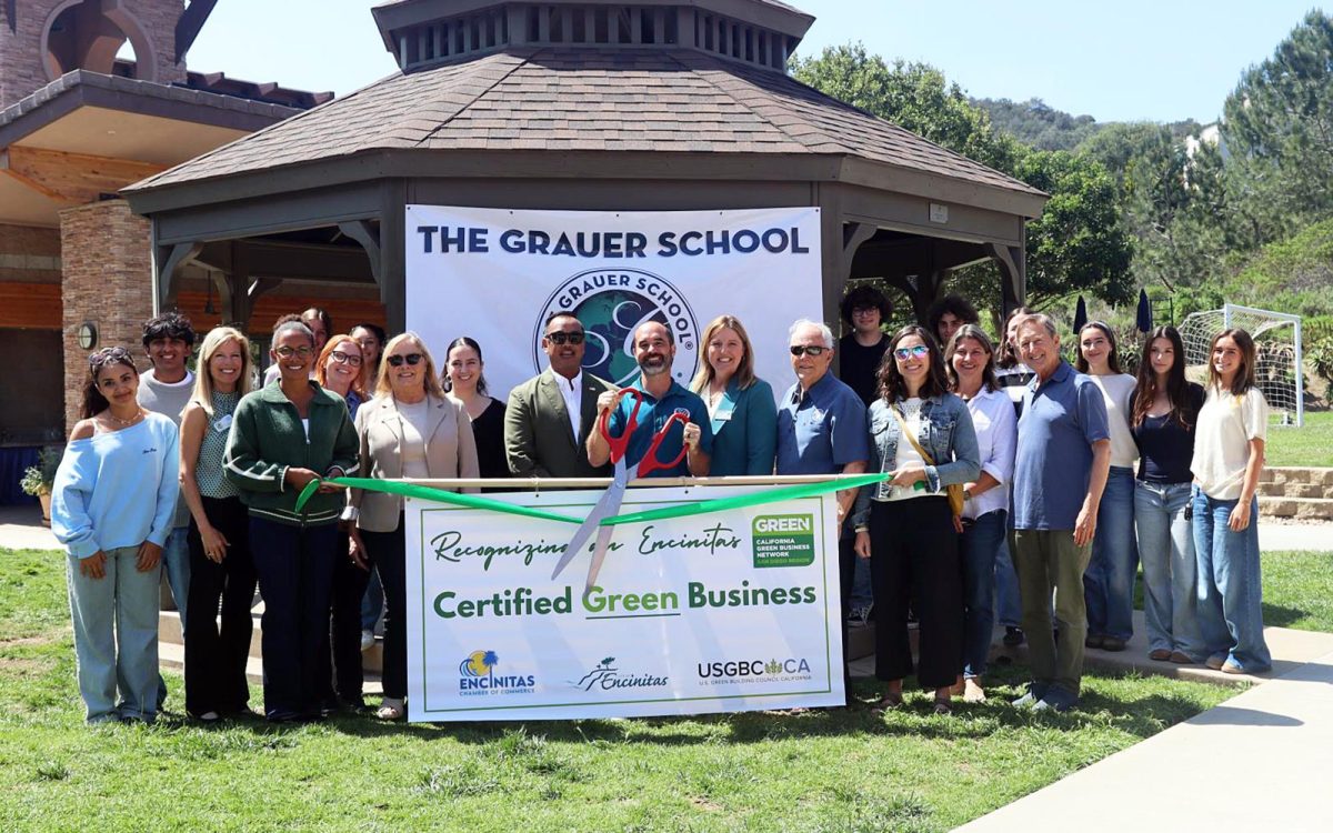 Grauer School officials and students join representatives from the city of Encinitas, U.S. Green Building Council California and Encinitas Chamber Of Commerce on March 24 to celebrate the school’s California Green Business certification. (Courtesy photo)