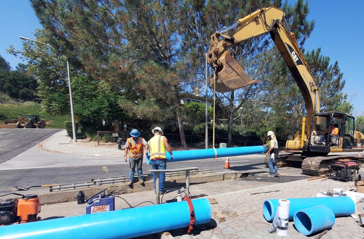 Olivenhain Municipal Water District workers replace pipe at Rancho Santa Fe Road near the border between Encinitas and Carlsbad this spring. (OMWD photo)
