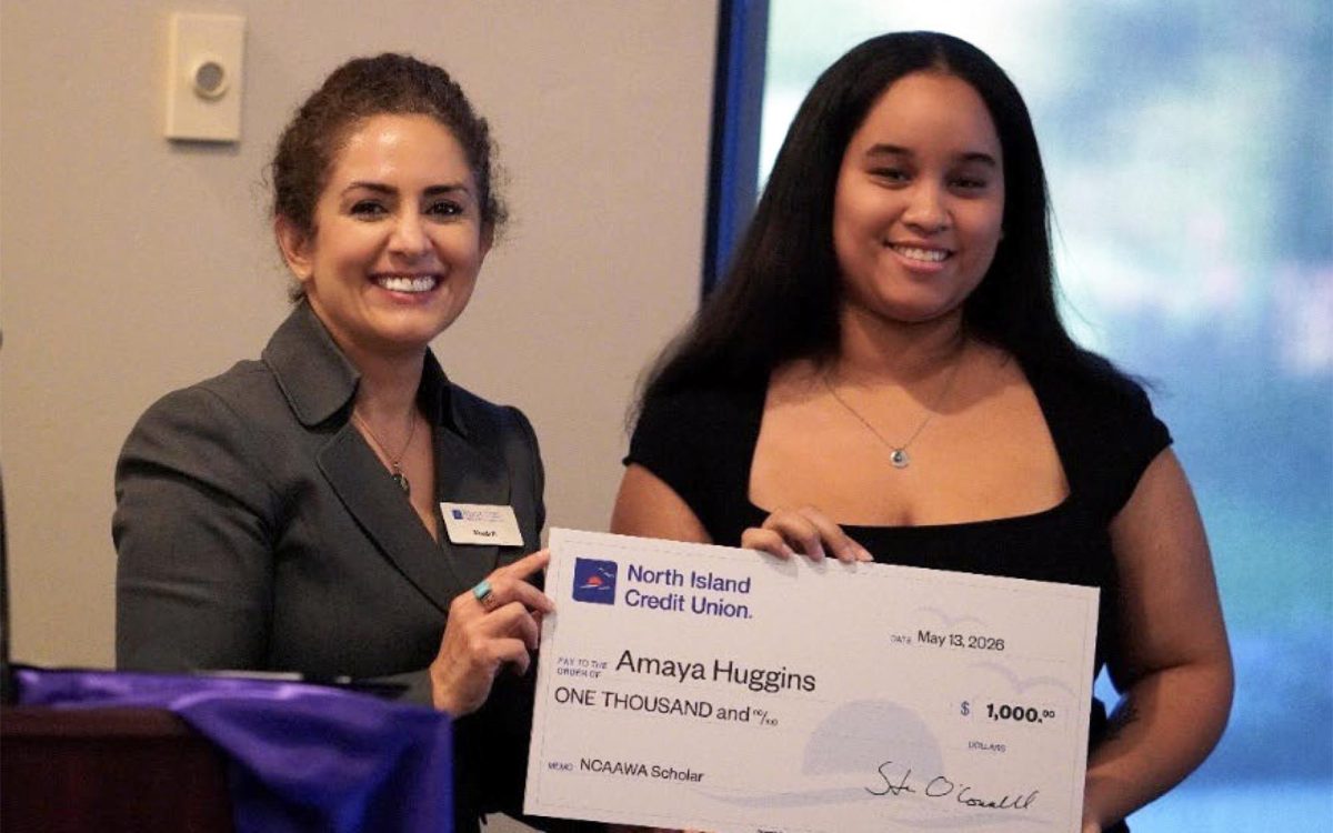 North Island Credit Union Senior School and Community Development Officer Shadi Poustchi (left) presents a scholarship to student Amaya Huggins during the North County African American Women’s Association’s 2026 Salute to Scholars Celebration on May 13 at El Camino Country Club in Oceanside. (North Island Credit Union photo)