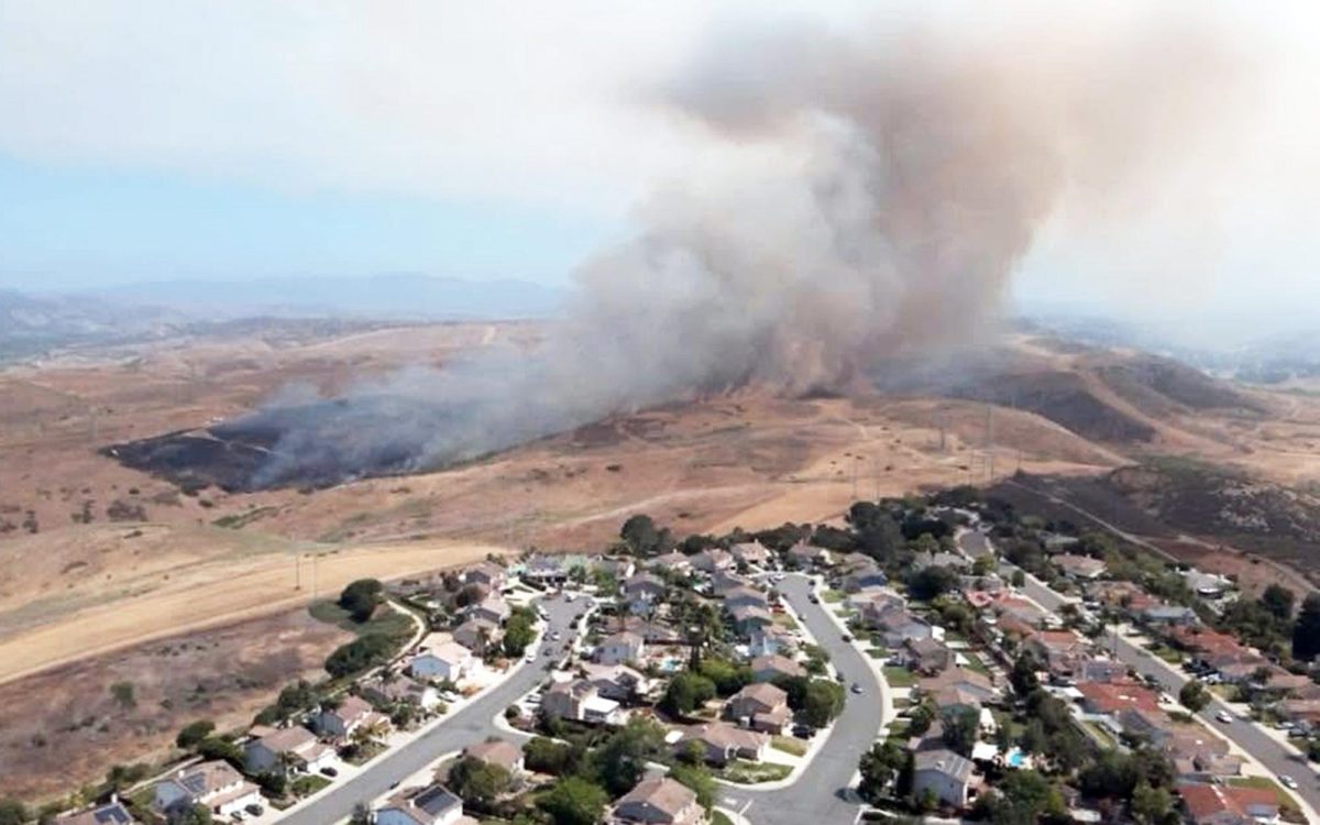 A brush fire on Camp Pendleton across the Oceanside border is shown in this Oceanside Police Department photo June 10. Marine base officials reported that the fire was fully contained June 12. (OPD social media photo)