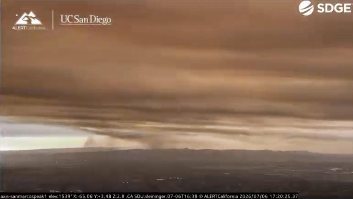 An image captured from Alert California UC San Diego video shows Pipeline Fire smoke flowing east and then south toward the system’s camera at San Marcos Peak just before 5:30 p.m. Monday, July 6. (Alert California UC San Diego)