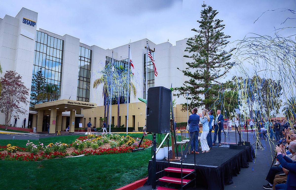 Sharp HealthCare and Tri-City Medical Center officials celebrate the combining of their systems’ names July 1 in Oceanside under a new operating agreement approved by voters in June. (CeCe Canton Photography via Sharp)
